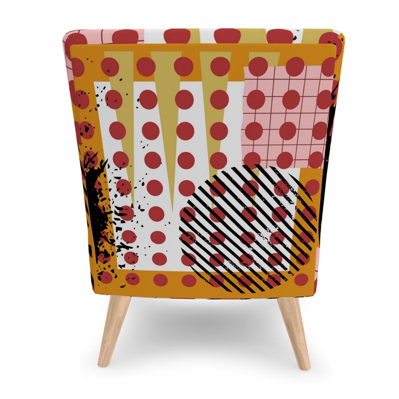 Back view Pop Art print which consists of large red circles, pink grid, long ochre spikes, black and white striped circle and golden yellow frame on armless accent chair with tapered beech wood legs.